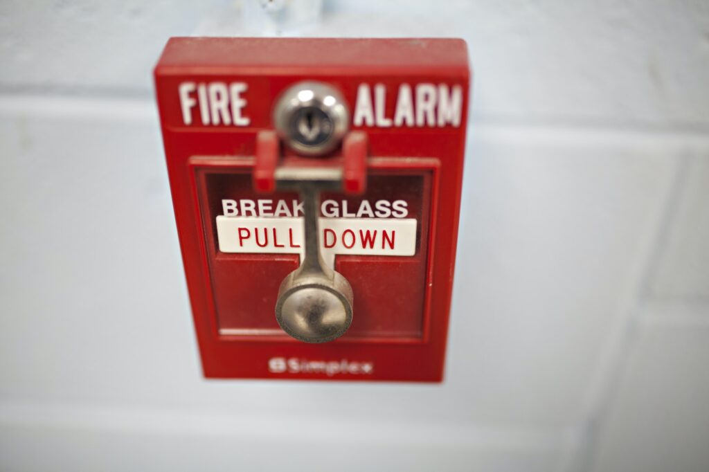 fire alarm on an industrial brick wall